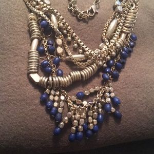 Gold metal with Lapis colored beads. NWOT